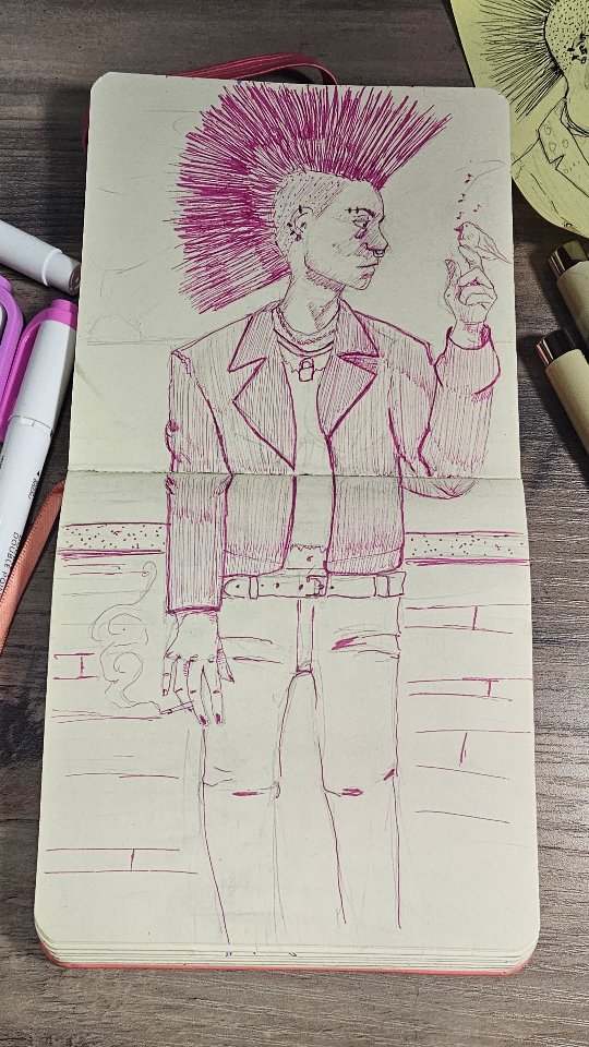 Punk character ink sketch with pink mohawk in sketchbook